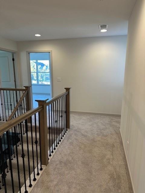 1309 N 4th St E, Louisburg, KS 66053 - hallway featuring an upstairs landing, carpet flooring, and recessed lighting