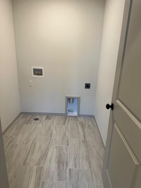 1309 N 4th St E, Louisburg, KS 66053 - laundry room with electric dryer hookup and washer hookup