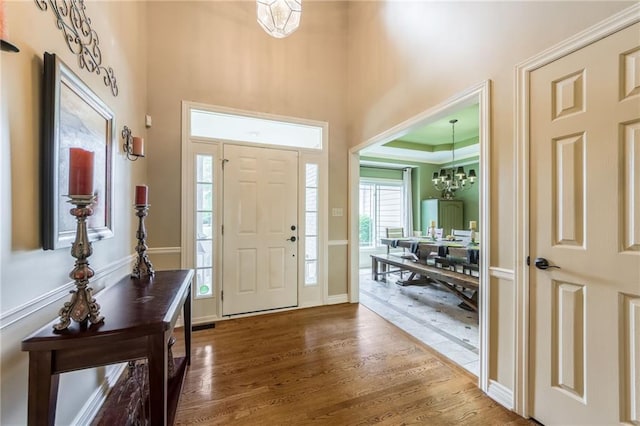 2621 SE 5th St, Lees Summit, MO 64063 - foyer entrance featuring wood finished floors and a chandelier