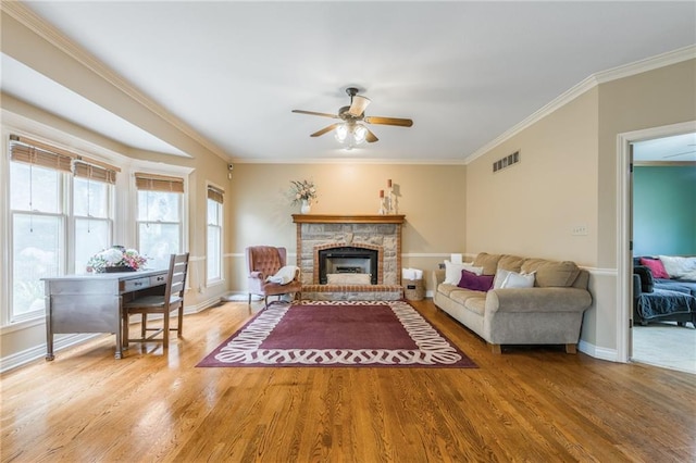 2621 SE 5th St, Lees Summit, MO 64063 - living room with wood finished floors, ceiling fan, crown molding, and healthy amount of natural light