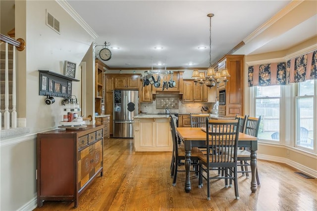 2621 SE 5th St, Lees Summit, MO 64063 - dining room featuring ornamental molding, light wood finished floors, and recessed lighting