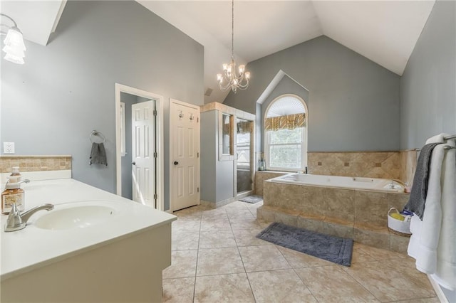 2621 SE 5th St, Lees Summit, MO 64063 - bathroom with lofted ceiling, a bath, a chandelier, a stall shower, and double vanity