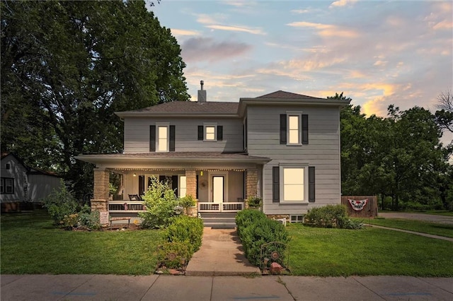 314 E Nichols St, Spring Hill, KS 66083 - view of front of home featuring a porch, a chimney, and a front yard
