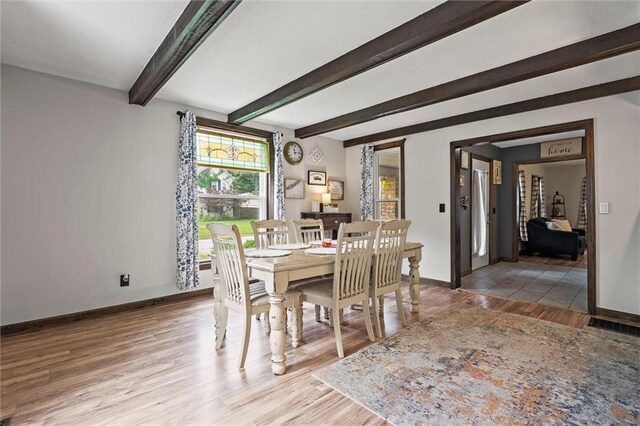 314 E Nichols St, Spring Hill, KS 66083 - dining space featuring light wood-style floors and beamed ceiling
