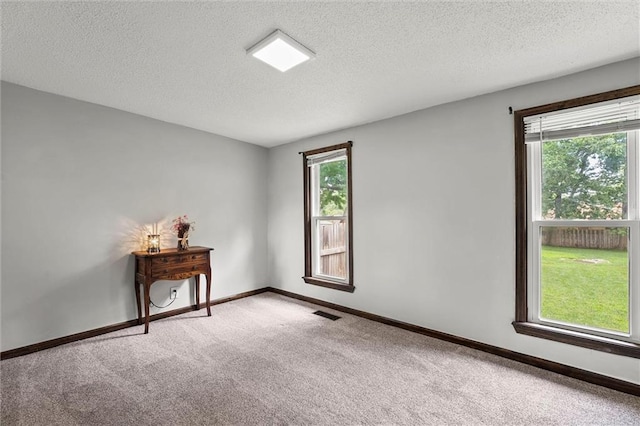 314 E Nichols St, Spring Hill, KS 66083 - carpeted empty room featuring a textured ceiling and baseboards