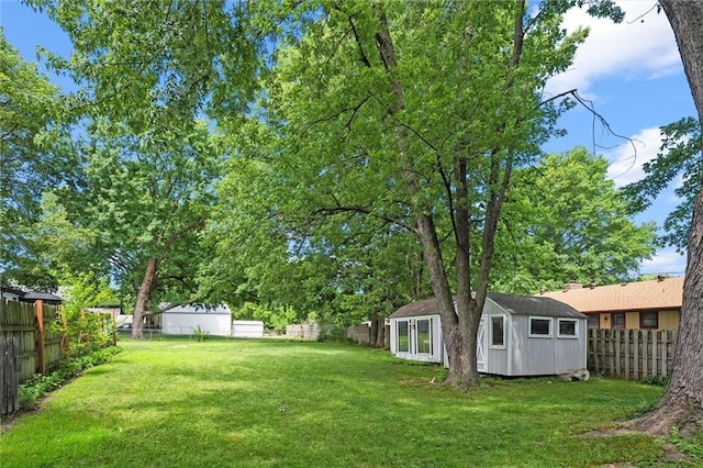 314 E Nichols St, Spring Hill, KS 66083 - fenced backyard featuring a storage unit