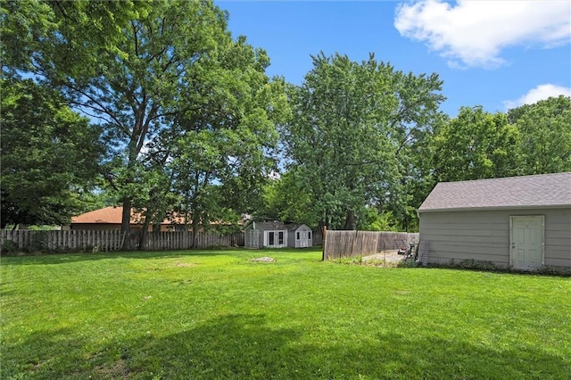 314 E Nichols St, Spring Hill, KS 66083 - fenced backyard with an outdoor structure