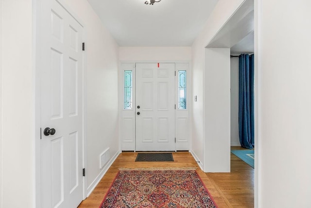 9201 Ensley Ln, Leawood, KS 66206 - entryway with light wood finished floors