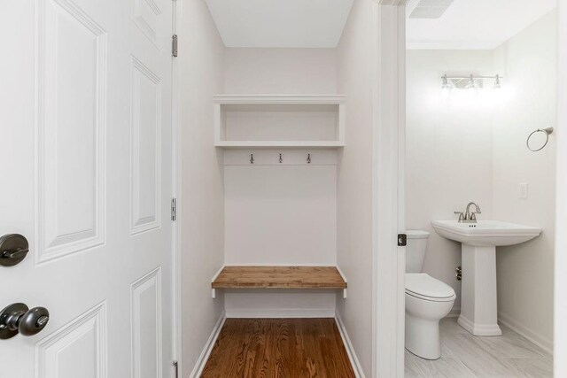 9201 Ensley Ln, Leawood, KS 66206 - bathroom with toilet and wood finished floors
