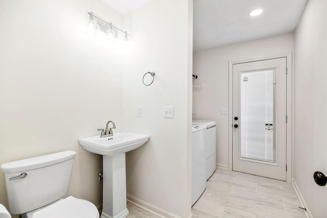9201 Ensley Ln, Leawood, KS 66206 - bathroom with washing machine and dryer and toilet