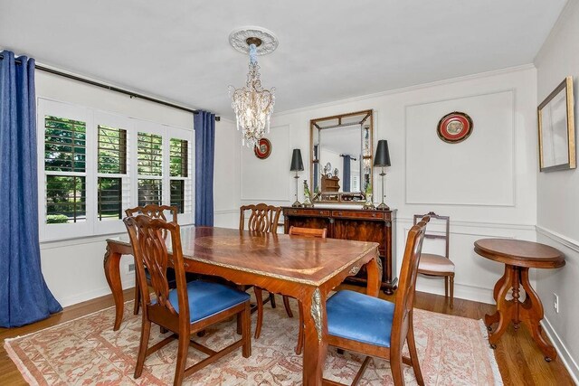 9201 Ensley Ln, Leawood, KS 66206 - dining area featuring a chandelier and light wood finished floors