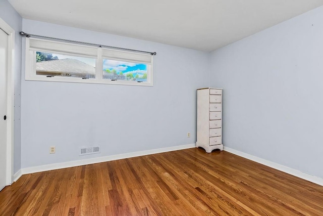9201 Ensley Ln, Leawood, KS 66206 - empty room with wood finished floors and baseboards
