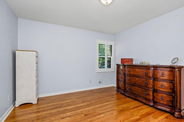 9201 Ensley Ln, Leawood, KS 66206 - bedroom with light wood-style floors and baseboards