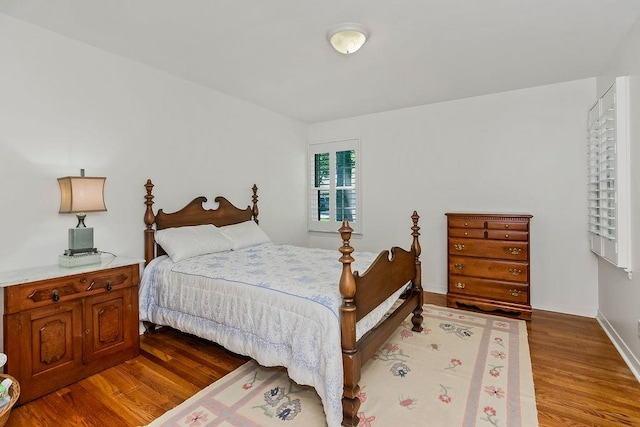 9201 Ensley Ln, Leawood, KS 66206 - bedroom featuring wood finished floors and baseboards