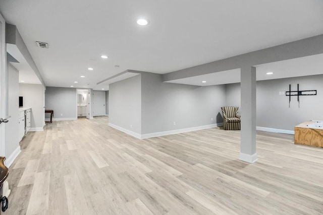 9201 Ensley Ln, Leawood, KS 66206 - finished basement with light wood-style flooring and recessed lighting