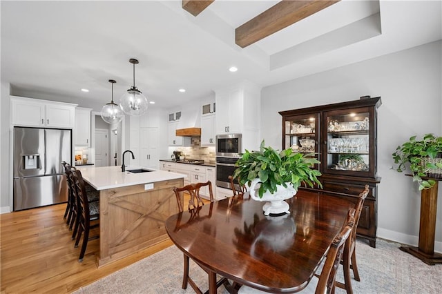 9260 Saddletop St, Lenexa, KS 66227 - dining room featuring recessed lighting, light wood-style floors, and beam ceiling