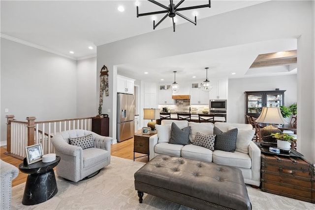 9260 Saddletop St, Lenexa, KS 66227 - living area featuring a chandelier, recessed lighting, light wood-type flooring, and crown molding