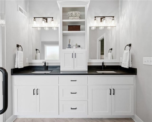 9260 Saddletop St, Lenexa, KS 66227 - bathroom featuring double vanity and baseboards
