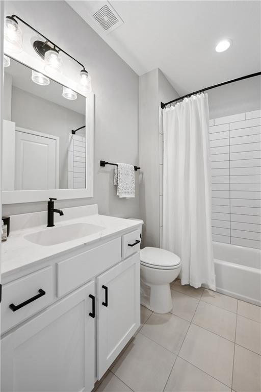 9260 Saddletop St, Lenexa, KS 66227 - bathroom featuring vanity, tile patterned flooring, and shower / bath combo