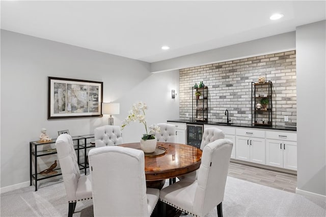 9260 Saddletop St, Lenexa, KS 66227 - dining space featuring bar with sink, beverage cooler, recessed lighting, and light colored carpet