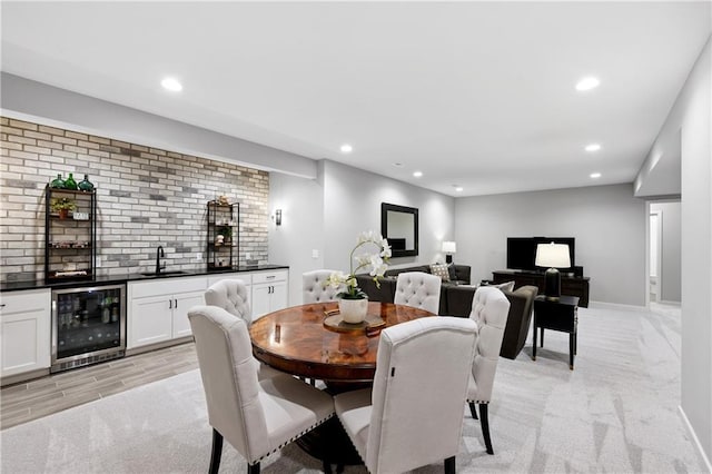9260 Saddletop St, Lenexa, KS 66227 - dining room featuring beverage cooler, bar with sink, light carpet, and recessed lighting