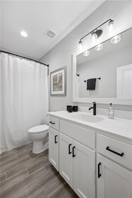 9260 Saddletop St, Lenexa, KS 66227 - bathroom featuring vanity and wood finished floors