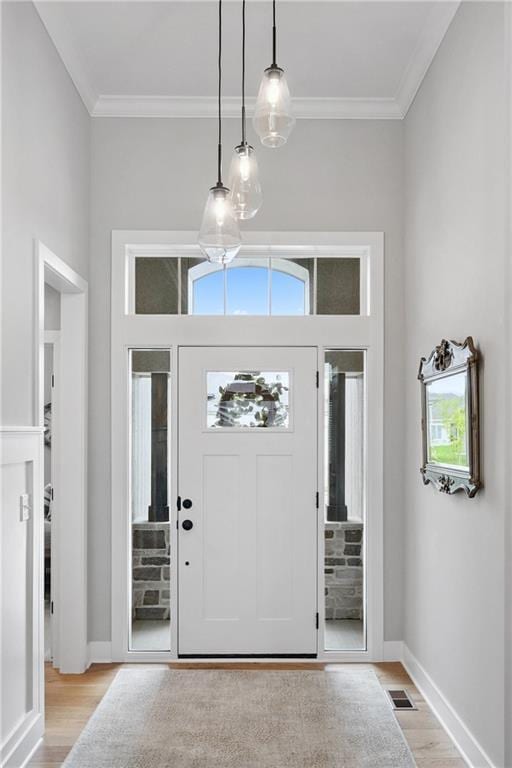 9260 Saddletop St, Lenexa, KS 66227 - entryway with light wood-type flooring and ornamental molding