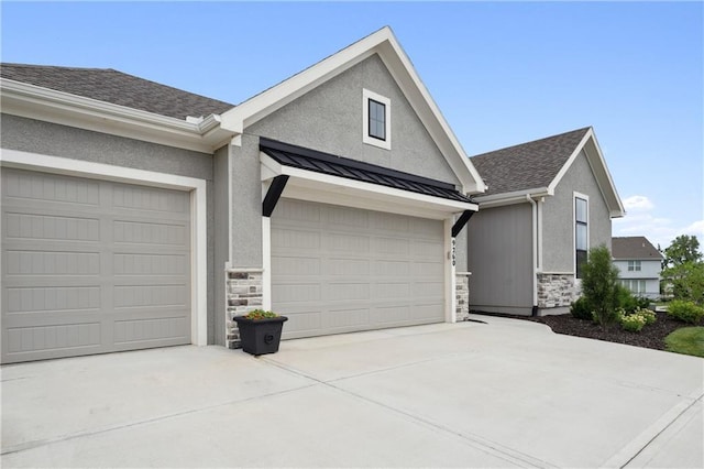 9260 Saddletop St, Lenexa, KS 66227 - view of front of property featuring stone siding, concrete driveway, stucco siding, and a standing seam roof