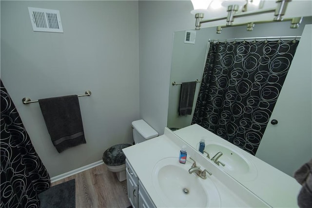 1005 Hunters Rd, Blue Springs, MO 64014 - bathroom with wood finished floors, vanity, and curtained shower