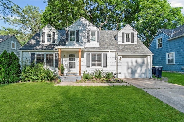 7712 Mcgee St, Kansas City, MO 64114 - cape cod-style house with driveway, a front yard, a garage, and a shingled roof