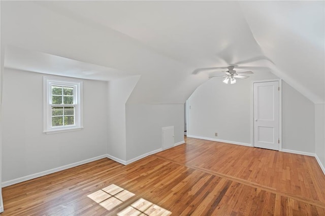 7712 Mcgee St, Kansas City, MO 64114 - additional living space with light wood-style flooring, vaulted ceiling, and a ceiling fan