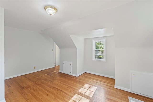 7712 Mcgee St, Kansas City, MO 64114 - additional living space with vaulted ceiling and light wood-style flooring