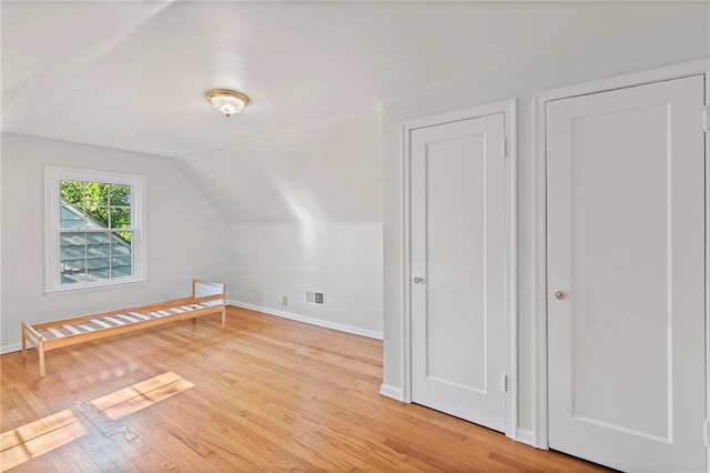 7712 Mcgee St, Kansas City, MO 64114 - bonus room with vaulted ceiling and light wood finished floors
