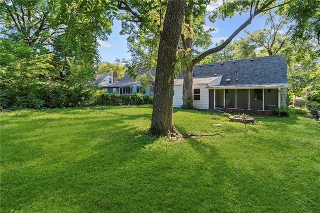 7712 Mcgee St, Kansas City, MO 64114 - view of grassy yard with a sunroom