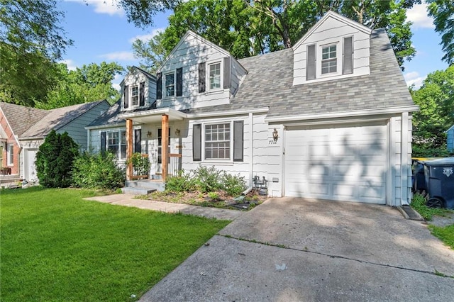 7712 Mcgee St, Kansas City, MO 64114 - new england style home featuring driveway, a front lawn, roof with shingles, and a garage
