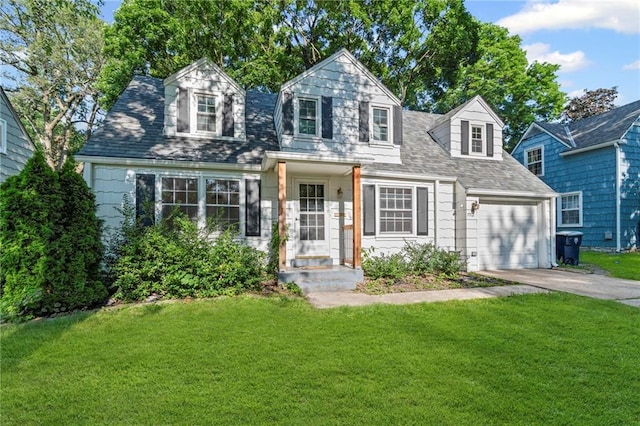 7712 Mcgee St, Kansas City, MO 64114 - new england style home with a front lawn, driveway, and a garage