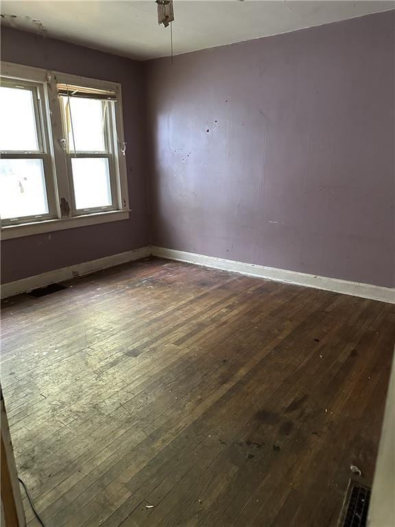 1906 S Willow Ave, Independence, MO 64052 - spare room with hardwood / wood-style floors and baseboards