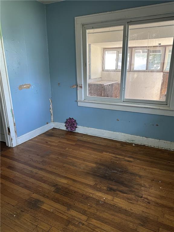 1906 S Willow Ave, Independence, MO 64052 - unfurnished room featuring dark wood finished floors