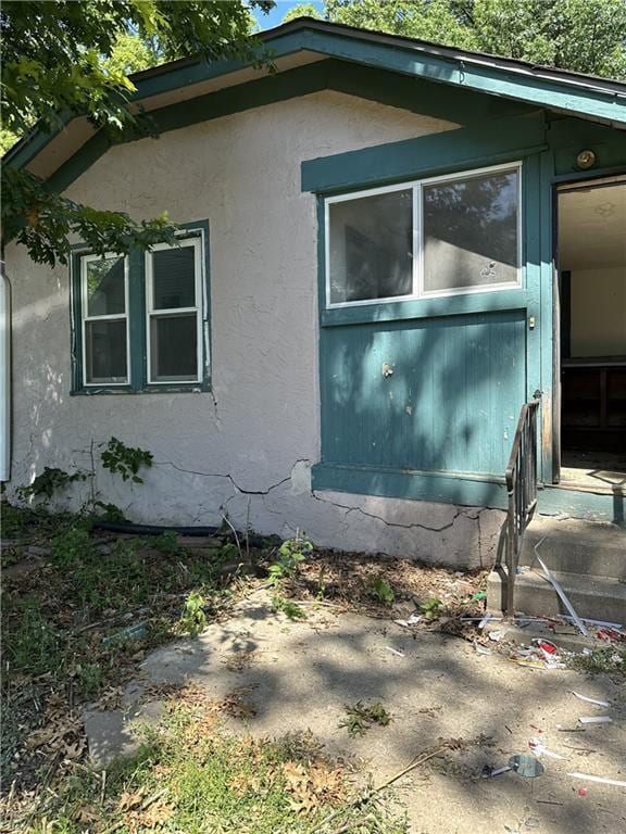 1906 S Willow Ave, Independence, MO 64052 - view of side of home featuring stucco siding