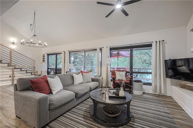 792 195th St, Fort Scott, KS 66701 - living area featuring vaulted ceiling, wood finished floors, stairway, a chandelier, and a ceiling fan
