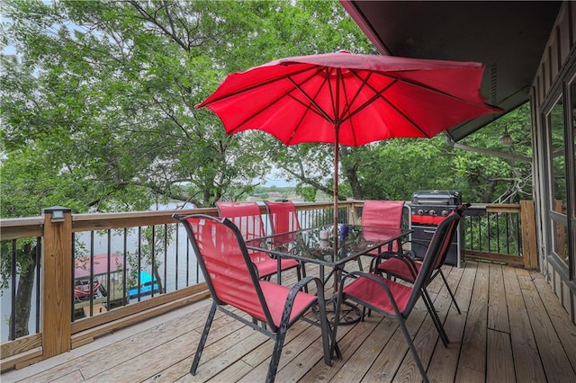 792 195th St, Fort Scott, KS 66701 - wooden terrace featuring outdoor dining area and area for grilling