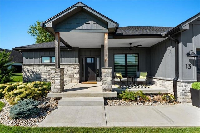 13 Tahoma Rdg, Lake Winnebago, MO 64034 - view of front of property featuring a ceiling fan, a porch, board and batten siding, and stone siding