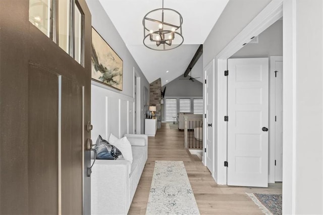 13 Tahoma Rdg, Lake Winnebago, MO 64034 - entryway featuring a chandelier, lofted ceiling, and light wood-style flooring