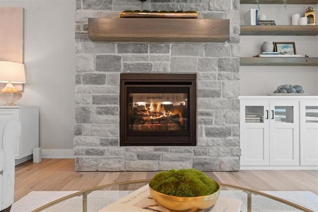 13 Tahoma Rdg, Lake Winnebago, MO 64034 - detailed view of wood finished floors and a fireplace