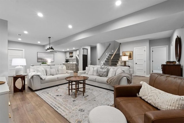 13 Tahoma Rdg, Lake Winnebago, MO 64034 - living area with stairway, light wood-style flooring, and recessed lighting