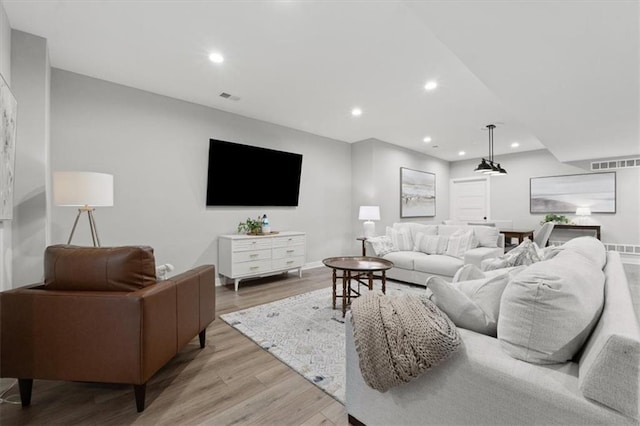 13 Tahoma Rdg, Lake Winnebago, MO 64034 - living area with light wood-style flooring and recessed lighting