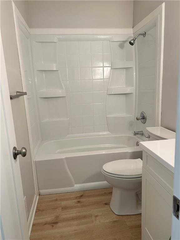 13006 Byars Rd, Grandview, MO 64030 - full bathroom with wood finished floors, vanity, and washtub / shower combination