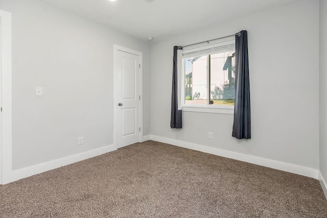 4724 E 135th Ct, Grandview, MO 64030 - carpeted spare room featuring baseboards