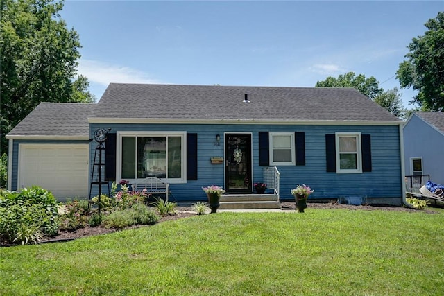 1421 W 28th Ter, Independence, MO 64052 - view of front of home with an attached garage and a front lawn
