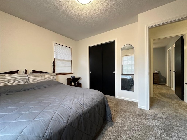 12913 E 41st St S, Independence, MO 64055 - bedroom with carpet flooring, multiple windows, and a textured ceiling
